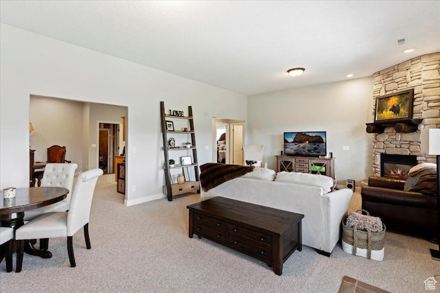 4147 N Wolf Ridge Cir, Eden, UT 84310 - living room with a stone fireplace and light carpet