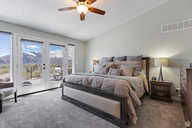 4147 N Wolf Ridge Cir, Eden, UT 84310 - carpeted bedroom with ceiling fan, a mountain view, vaulted ceiling, a textured ceiling, and access to outside