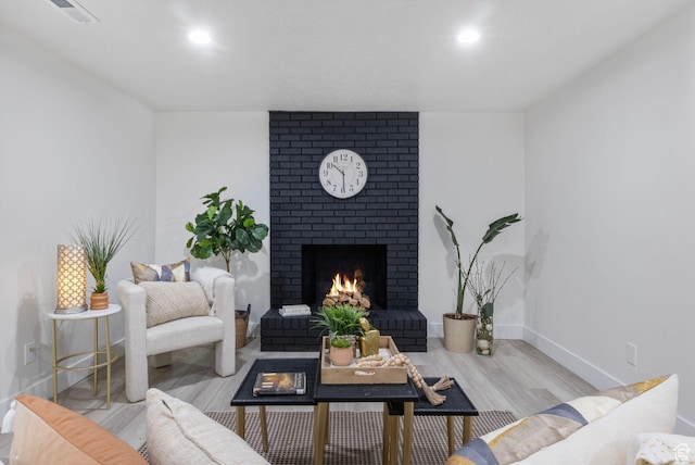1578 E Delaware Ln S, Holladay, UT 84117 - living room featuring a fireplace and light hardwood / wood-style flooring