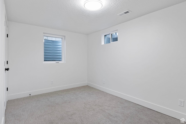1578 E Delaware Ln S, Holladay, UT 84117 - spare room with light carpet and a textured ceiling