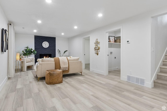 1578 E Delaware Ln S, Holladay, UT 84117 - living room with a fireplace and light hardwood / wood-style flooring
