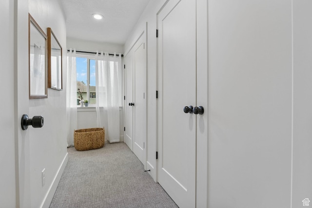 1578 E Delaware Ln S, Holladay, UT 84117 - hallway featuring light carpet and a textured ceiling