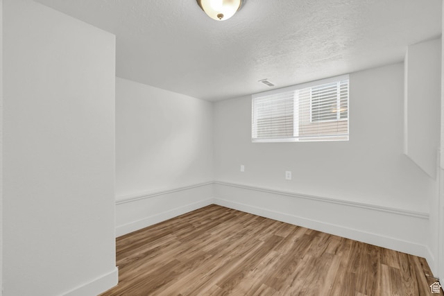256 Bubbling Brook Ln, Draper, UT 84020 - empty room with a textured ceiling and hardwood / wood-style flooring
