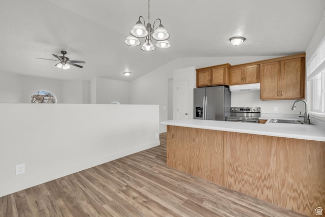 256 Bubbling Brook Ln, Draper, UT 84020 - kitchen with pendant lighting, sink, appliances with stainless steel finishes, light hardwood / wood-style floors, and kitchen peninsula