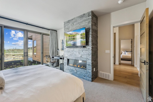 6242 Double Deer Loop, Park City, UT 84098 - bedroom with a fireplace, access to outside, and carpet floors