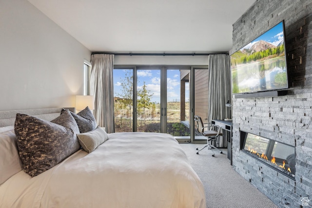6242 Double Deer Loop, Park City, UT 84098 - bedroom with carpet, a stone fireplace, and access to exterior