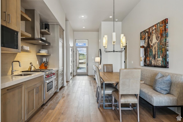 6242 Double Deer Loop, Park City, UT 84098 - kitchen featuring a sink, open shelves, luxury stove, wall chimney exhaust hood, and black microwave