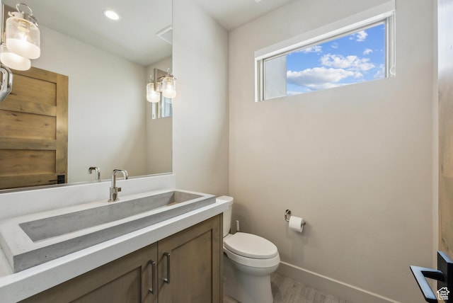 6242 Double Deer Loop, Park City, UT 84098 - bathroom with toilet, wood finished floors, vanity, and baseboards