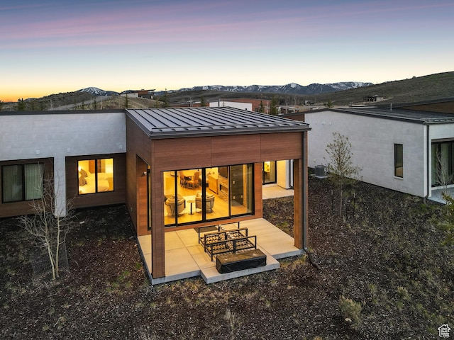 6242 Double Deer Loop, Park City, UT 84098 - rear view of property with a standing seam roof, metal roof, a mountain view, and a patio area