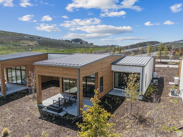 6242 Double Deer Loop, Park City, UT 84098 - back of house featuring a standing seam roof, a patio area, and metal roof
