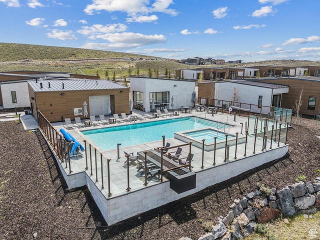 6242 Double Deer Loop, Park City, UT 84098 - view of swimming pool with a pool with connected hot tub, fence, and a patio area