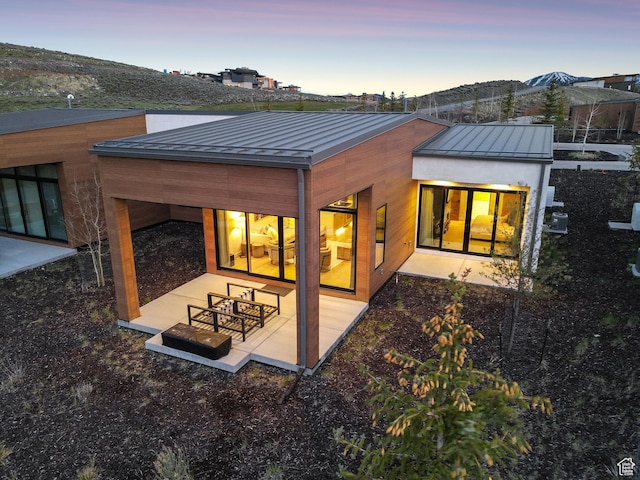 6242 Double Deer Loop, Park City, UT 84098 - back of house featuring a standing seam roof, a patio, and metal roof