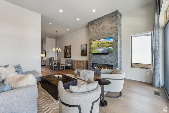 6242 Double Deer Loop, Park City, UT 84098 - living room featuring light wood-style floors, a fireplace, a chandelier, and recessed lighting