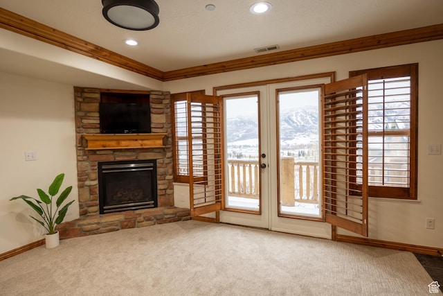 5063 E Lakeview Dr Unit 1009, Eden, UT 84310 - unfurnished living room featuring carpet floors, a stone fireplace, and ornamental molding