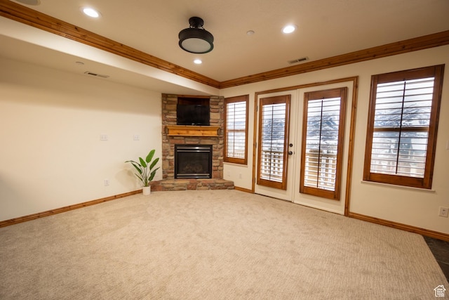 5063 E Lakeview Dr Unit 1009, Eden, UT 84310 - unfurnished living room featuring carpet, french doors, a stone fireplace, and crown molding