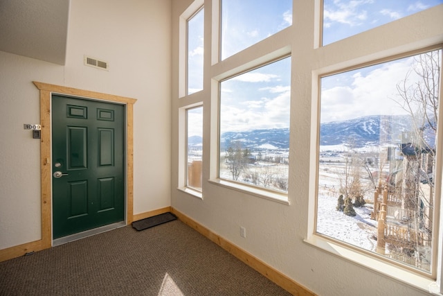 5063 E Lakeview Dr Unit 1009, Eden, UT 84310 - entryway featuring carpet flooring, a mountain view, and a towering ceiling