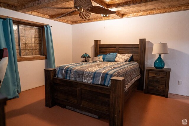 bedroom featuring beam ceiling and ceiling fan