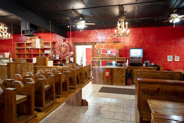 interior space with ceiling fan