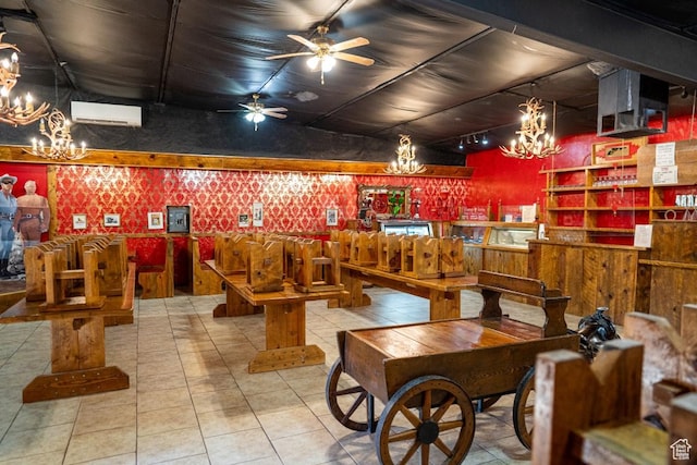 rec room with ceiling fan with notable chandelier and a wall mounted AC