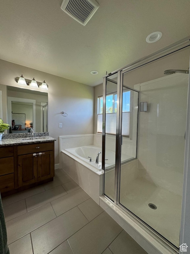 bathroom with vanity, separate shower and tub, and tile patterned floors