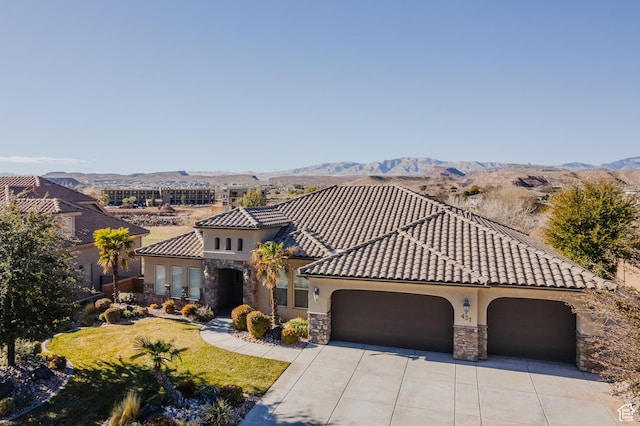 437 N Northstar Dr, St George, UT 84770 - mediterranean / spanish-style home with a mountain view, a garage, and a front lawn