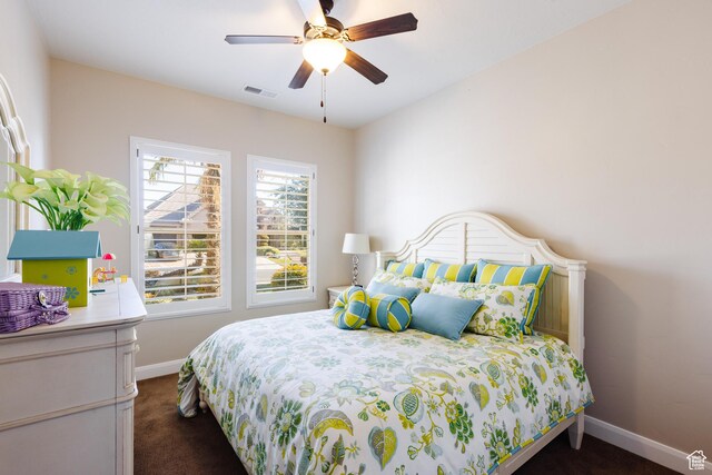 437 N Northstar Dr, St George, UT 84770 - bedroom featuring ceiling fan and dark colored carpet