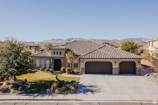 437 N Northstar Dr, St George, UT 84770 - mediterranean / spanish-style house featuring a garage and a mountain view