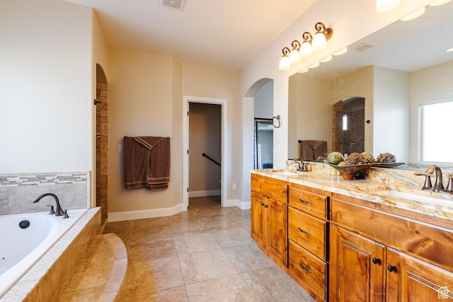 437 N Northstar Dr, St George, UT 84770 - bathroom featuring vanity, tile patterned flooring, and tiled bath