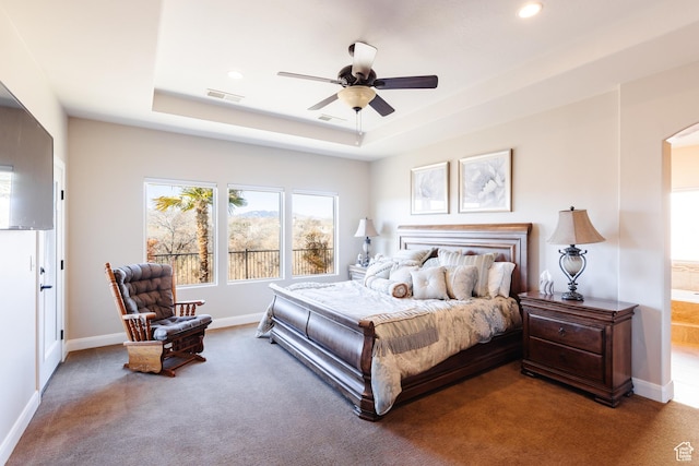 437 N Northstar Dr, St George, UT 84770 - carpeted bedroom with a raised ceiling, connected bathroom, and ceiling fan