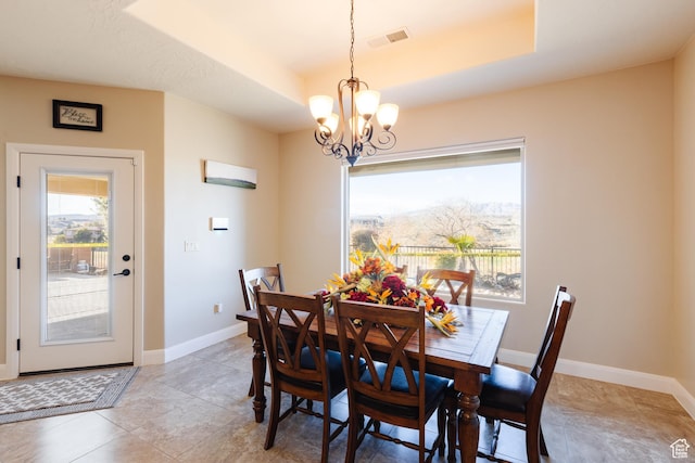 437 N Northstar Dr, St George, UT 84770 - dining space featuring a tray ceiling and a chandelier