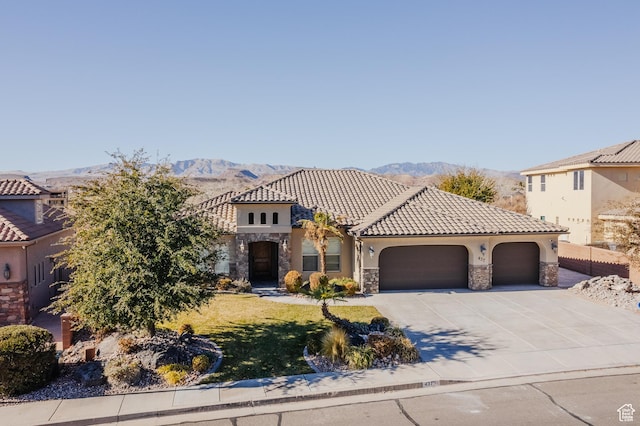 437 N Northstar Dr, St George, UT 84770 - mediterranean / spanish-style home featuring a garage and a mountain view