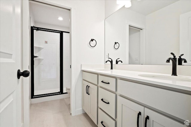 7029 W S Jordan Pkwy Unit 380, South Jordan, UT 84009 - bathroom with a stall shower, double vanity, tile patterned flooring, toilet, and baseboards