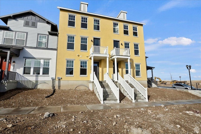 7029 W S Jordan Pkwy Unit 380, South Jordan, UT 84009 - view of property with stucco siding and a balcony