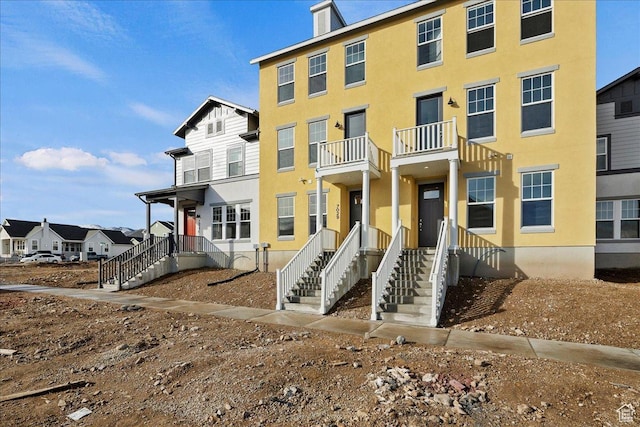 7029 W S Jordan Pkwy Unit 380, South Jordan, UT 84009 - view of front of home featuring stucco siding and a balcony