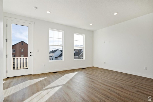 7029 W S Jordan Pkwy Unit 380, South Jordan, UT 84009 - empty room with wood finished floors, baseboards, and recessed lighting