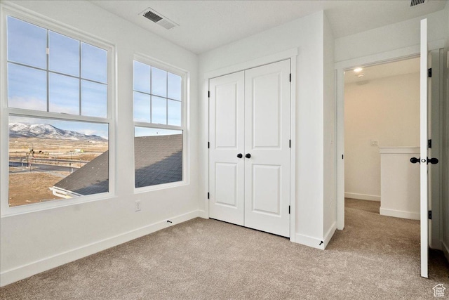 7029 W S Jordan Pkwy Unit 380, South Jordan, UT 84009 - unfurnished bedroom featuring carpet flooring, baseboards, and a closet