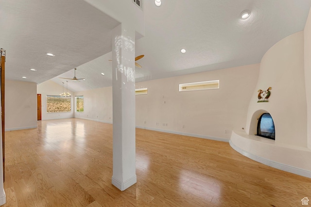 631 N 380 W, La Verkin, UT 84745 - unfurnished living room featuring vaulted ceiling, light wood-type flooring, baseboards, a chandelier, and recessed lighting