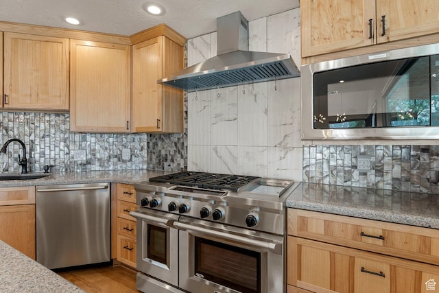 631 N 380 W, La Verkin, UT 84745 - kitchen featuring appliances with stainless steel finishes, wall chimney exhaust hood, a sink, light brown cabinets, and decorative backsplash