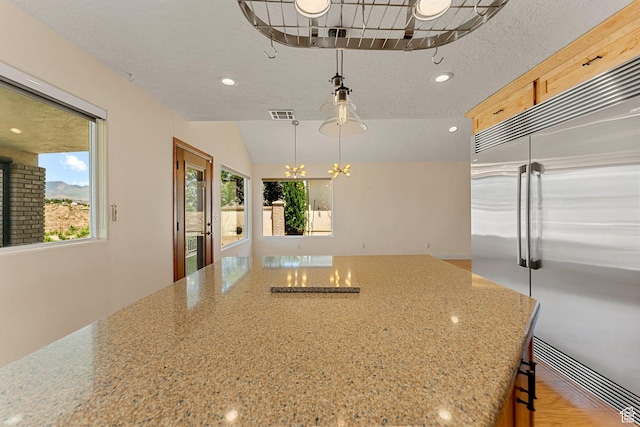 631 N 380 W, La Verkin, UT 84745 - kitchen featuring built in refrigerator, a chandelier, light stone countertops, recessed lighting, and hanging light fixtures