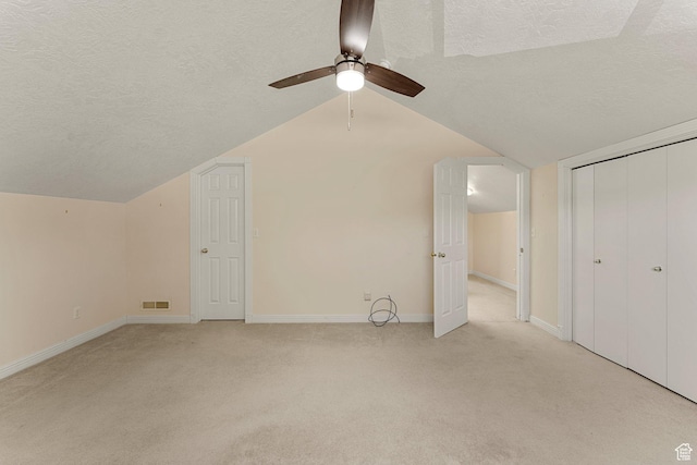 631 N 380 W, La Verkin, UT 84745 - additional living space with a textured ceiling, light colored carpet, ceiling fan, vaulted ceiling, and baseboards