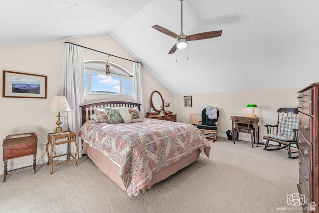 bedroom with a textured ceiling, light colored carpet, a ceiling fan, lofted ceiling, and baseboards