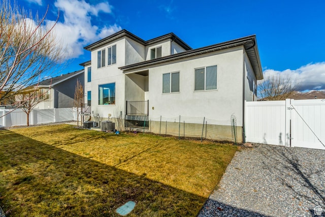 1153 W 1425th Dr N, Lehi, UT 84043 - rear view of house with a lawn and central AC unit