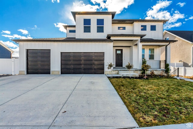 view of front facade with a garage and a front yard
