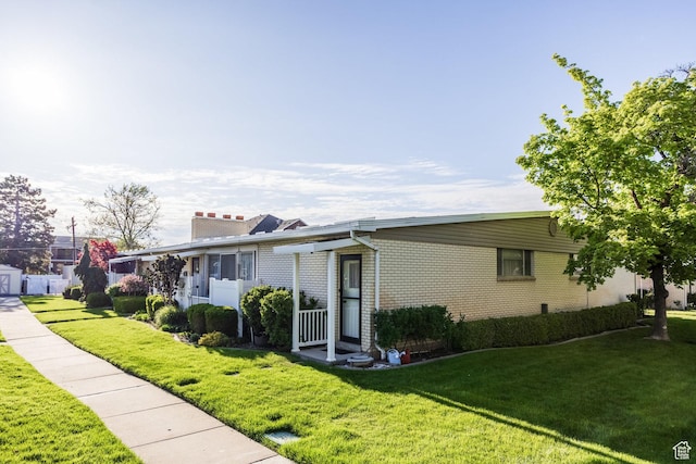 395 W 400 N Unit 39, Bountiful, UT 84010 - single story home featuring brick siding, a chimney, and a front yard