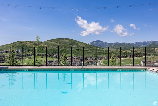 view of pool with a mountain view