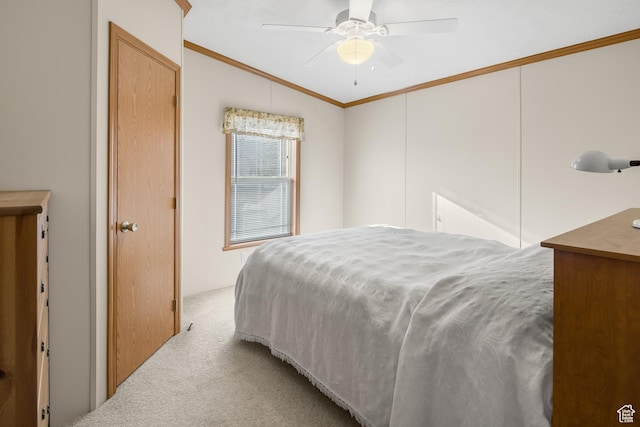bedroom featuring light carpet, vaulted ceiling, ceiling fan, and crown molding