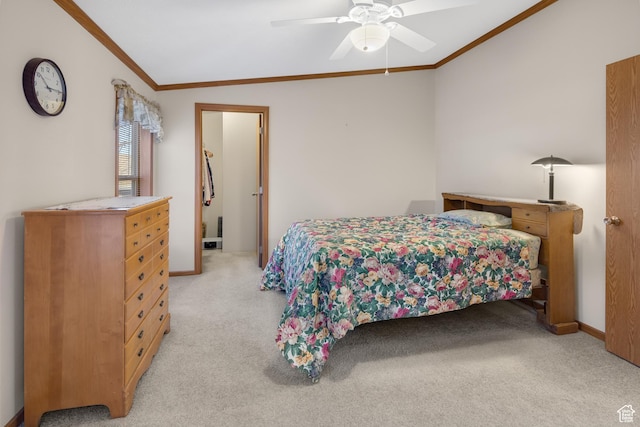 carpeted bedroom with ceiling fan, crown molding, and lofted ceiling