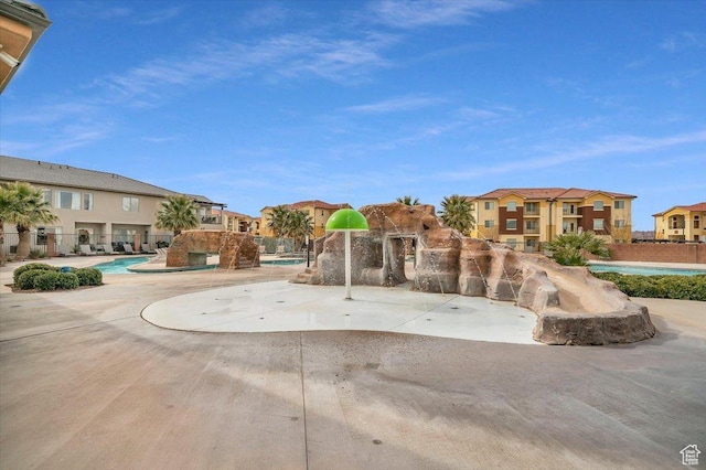 view of home's community featuring a pool