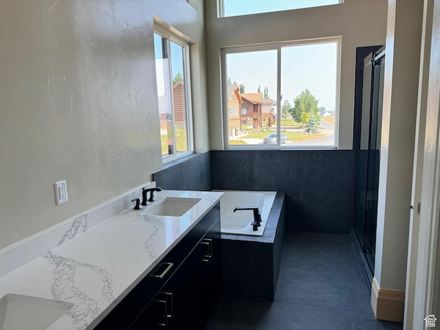 2584 S Country Club Dr Unit 12, Garden City, UT 84028 - bathroom featuring plenty of natural light, a bath, vanity, and a stall shower