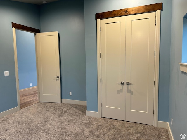 2584 S Country Club Dr Unit 12, Garden City, UT 84028 - unfurnished bedroom with carpet and a closet